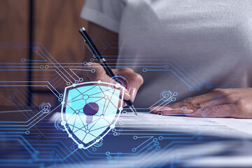 A businesswoman in casual wear signing the contract to prevent probability of risks in cyber...