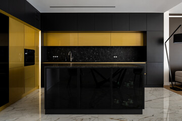 Luxury kitchen with black and gold furniture
