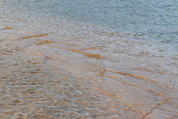 Oncoming waves on the shallows on the river