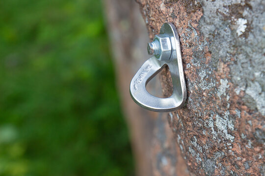 Close-up Of Reusable Rock Climbing Bolt On Rock Face. Climbing Equipment Designed To Organize Belay Points On The Rocks.