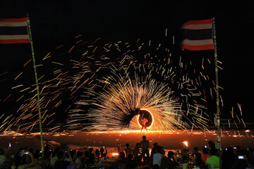Koh Samet, Rayong, Thailand, 18 April 2019, beautiful fire circle spining show talent at night party beach island in thailand