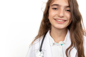 Portrait of a cute little girl dressed as a doctor with a stethoscope.