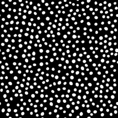 Vector illustration. Spotted black and white seamless pattern. Geometric abstract pattern with circles by hand.