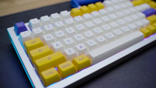 footage of a premium custom keyboard build kit with full alluminium base and bright RGB LED Colors