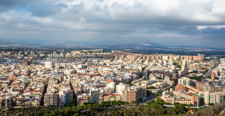 panoramic aerial view of Alicante city on a cloudy day  