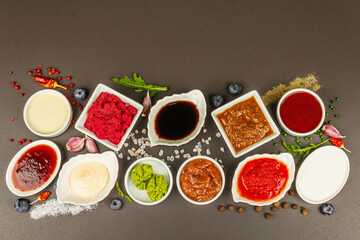 Set of different sauces - ketchup, mayonnaise, barbecue, soy, chutney, wasabi, adjika, horseradish
