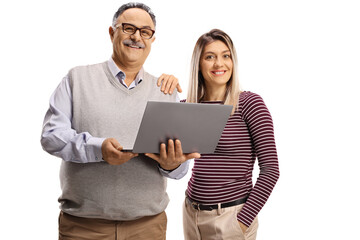 Young woman and an elderly man with a laptop computer looking at camera