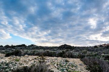 alicante's mountain scenery with a cloudy sky on a winter's afternoon 