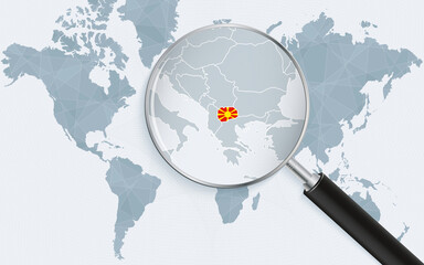 World map with a magnifying glass pointing at Macedonia. Map of Macedonia with the flag in the loop.
