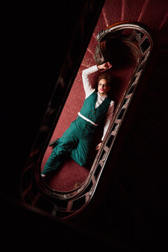 Dead male actor lying on floor during performance