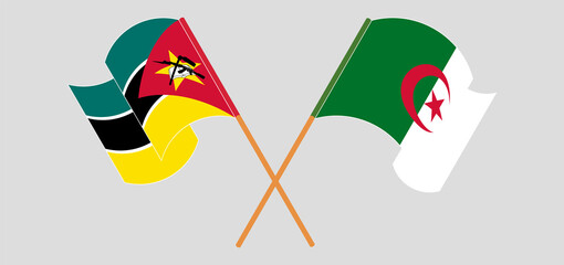 Crossed and waving flags of Mozambique and Algeria