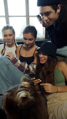 Five stylish children of different ages laugh at the internet meme 