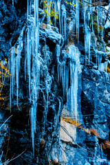 Close-up background textures of icebergs fallen and frozen in winter, Pyrenees, national park reserve, Spain. Vertical view