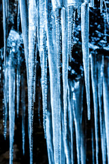 Close-up background textures of icebergs fallen and frozen in winter, Pyrenees, national park reserve, Spain. Vertical view
