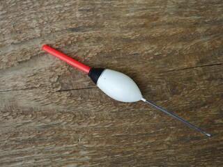 large white bobber with red antenna close-up, still life © mrivserg