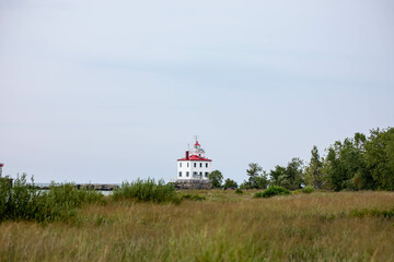 Fototapeta na wymiar Fairport Harbor West Breakwater Lighthouse in coastal dunes
