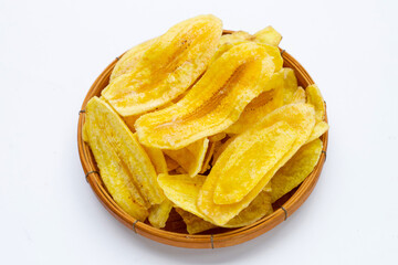 Banana slice chips bamboo basket on white background