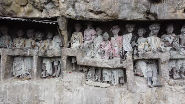 Toraja, South Sulawesi, Indonesia - Tau Tau, Effigy Made of Wood Bamboo and Stone Graves of Tana Toraja, Burial Sites Carved into Rocky Cliffs