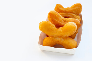 Deep-fried dough sticks or chinese bread sticks on white background.