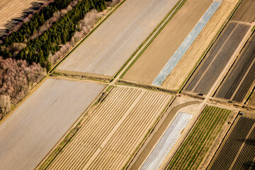 Fototapeta premium Scenic landscape with aerial view of agricultural fields in springtime, Quebec, Canada