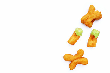 Deep-fried dough stick or chinese bread stick with steamed custard on white background.