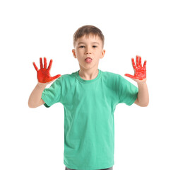 Little boy with hands in paint showing tongue on white background