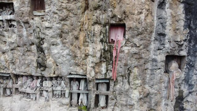 Toraja, South Sulawesi, Indonesia - Tau Tau, Effigy Made of Wood Bamboo and Stone Graves of Tana Toraja, Burial Sites Carved into Rocky Cliffs
