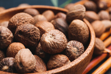 Bowl of shea nuts on table, closeup