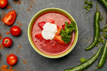 Composition with tasty borscht on dark background