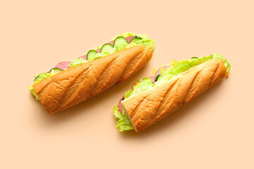 Tasty sandwiches on color background