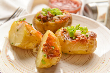 Plate with baked potato, closeup