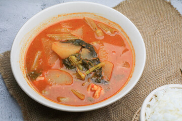 Kaeng som , is Spicy Thai Sour Curry with Shrimp and green papaya. Traditional Thai food recipe, Most popular dish in Thailand.