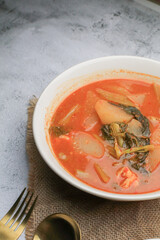 Kaeng som , is Spicy Thai Sour Curry with Shrimp and green papaya. Traditional Thai food recipe, Most popular dish in Thailand.