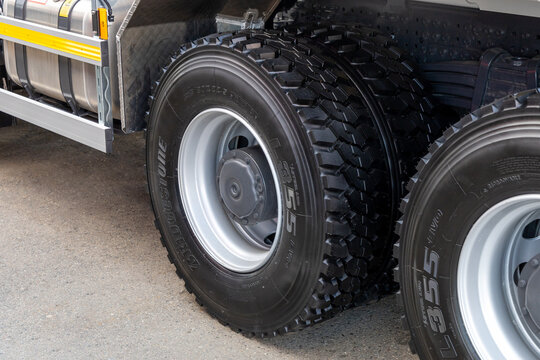 A close-up of the rear wheels of a truck with new Bridgestone L355 tires. Tubeless tires on a clean truck. Trucking concept. Moscow, Russia - May 25, 2021