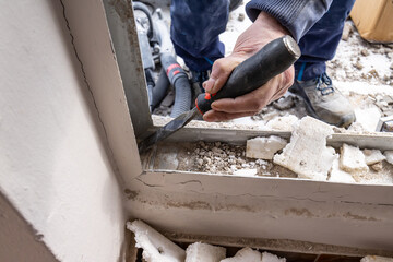 Removing cement with a chisel