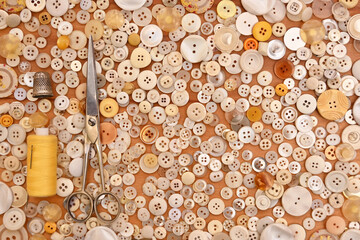 Buttons, scissors, thimble, thread and needle for sewing. Seamstress. Yellow 