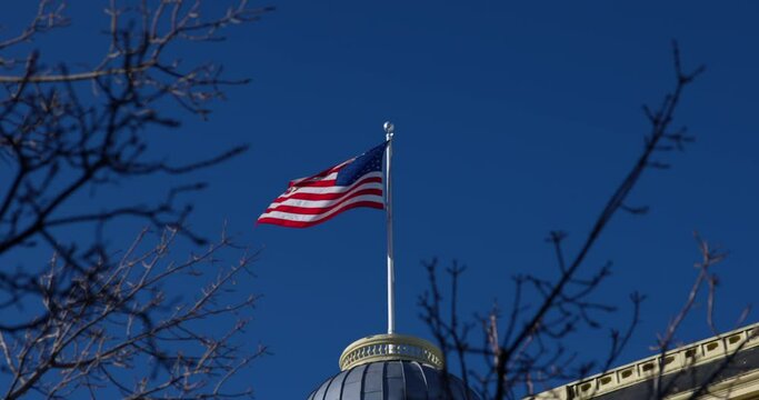 Slow Motion Shot Of National Flag Waning Over Dome Structure On Sunny Day - Aspen, Colorado