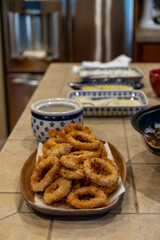 Fried Calamari Squid Rings Freshly Cooked on Platter in Kitchen