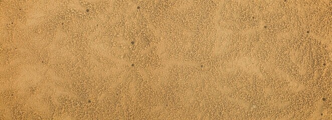Panorama of Clean brown fine sand for use as a background