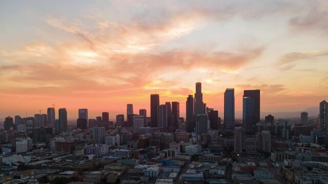 Aerial hyperlapse of epic sunset sky over Los Angeles skyline