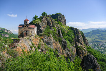 Fototapeta na wymiar An ancient Ossetian Orthodox church built in the 9th-10th century in the mountains of the Caucasus