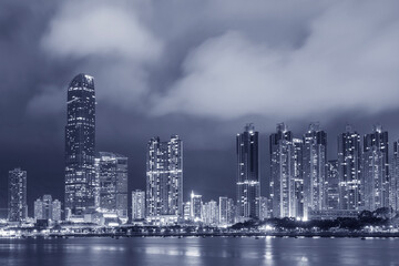 Skyline and harbor of Hong Kong city at night