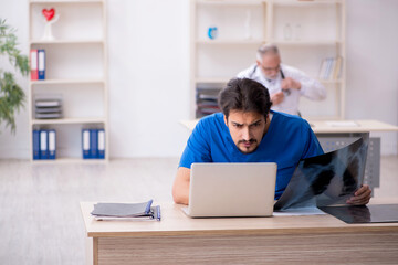 Two male doctors radiologists working in the clinic