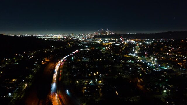 Aerial hyperlapse over city lights in Los Angeles at night