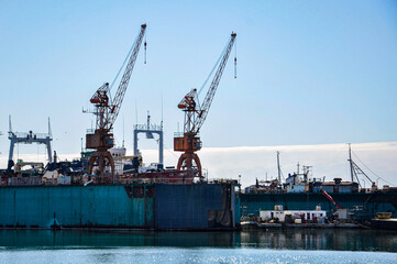 Two cranes on a floating dock in the port of Mar del Plata