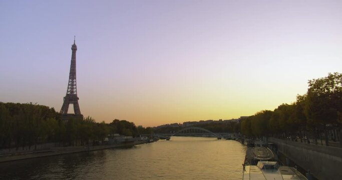 Majestic Eiffel Tower and river Seine during sunset time in Paris, static view