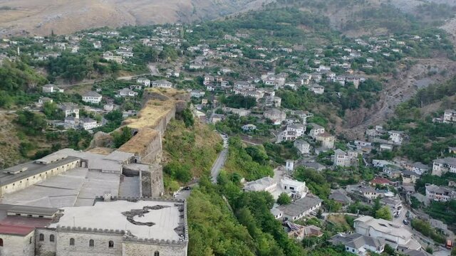 Castle of Gjirokastra and city center. Aerial view of ancient fortress Albania