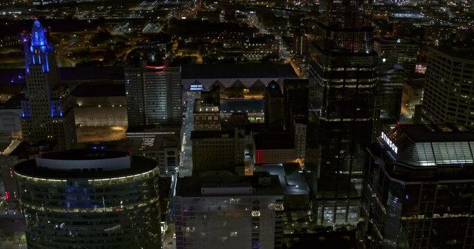 Kansas Missouri Aerial v4 establishing shot of drone flying forward above illuminated skyscrapers in downtown financial district at night - Shot with Inspire 2, X7 camera - August 2020