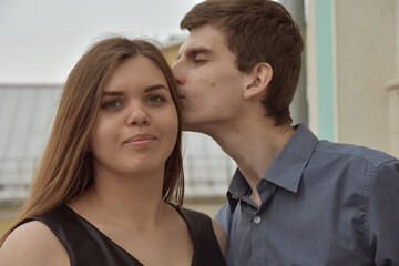 Handsome man kissing happy wife
