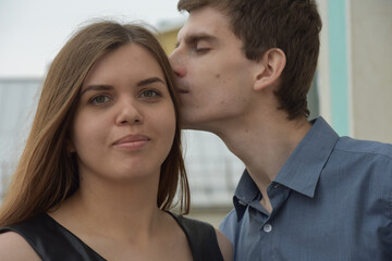 Handsome man kissing happy wife